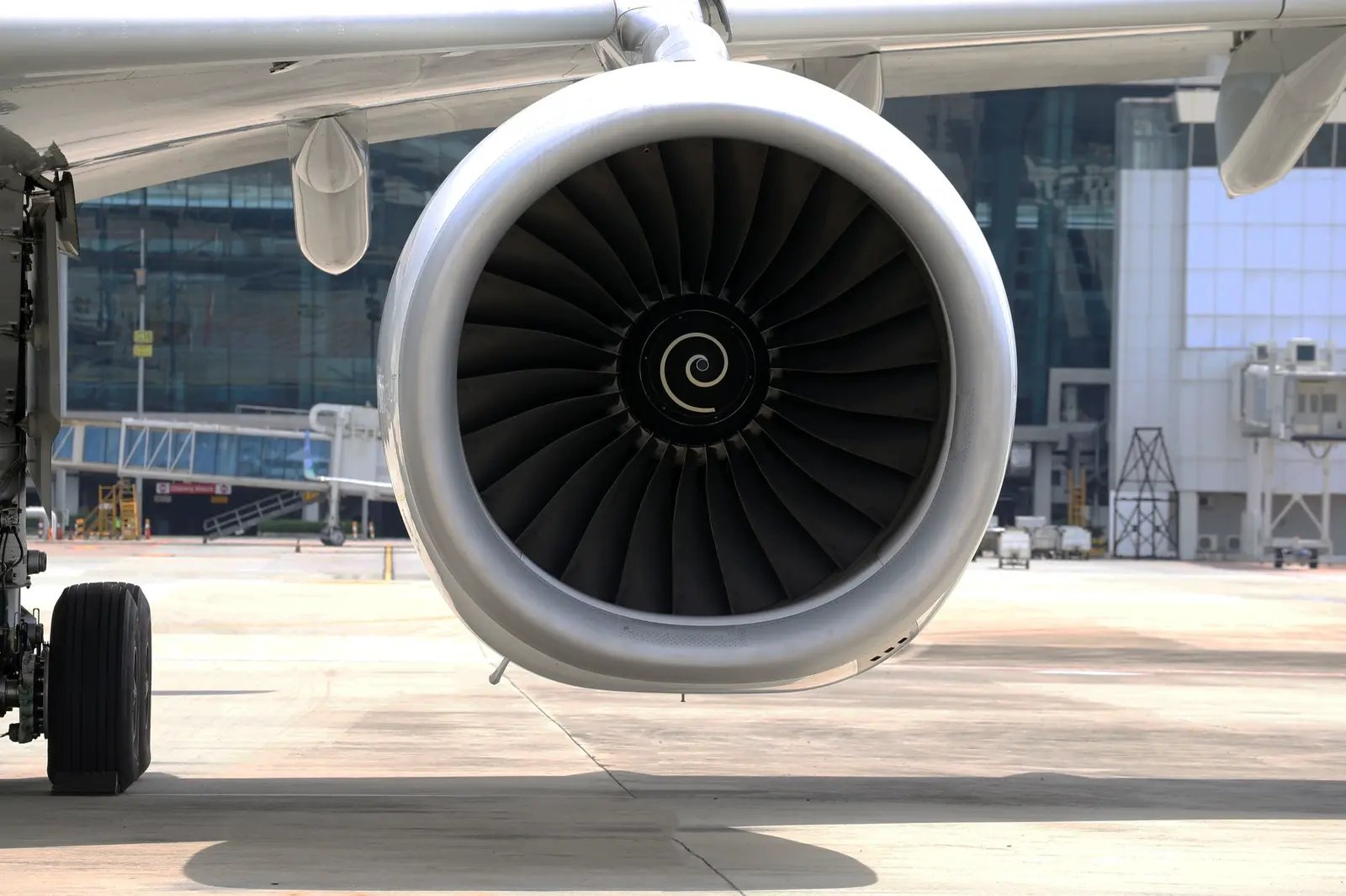 An airliner engine nacelle head-on at the stand.