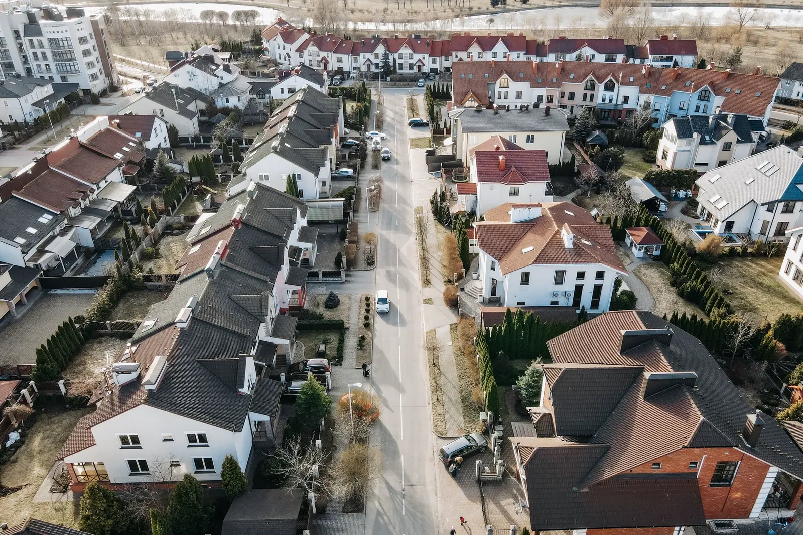 Rows of houses along a residential street, seen from above.